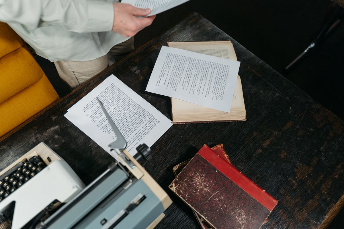 Vintage typewriter with a manuscript page, evoking the craft of matching an author's original writing style