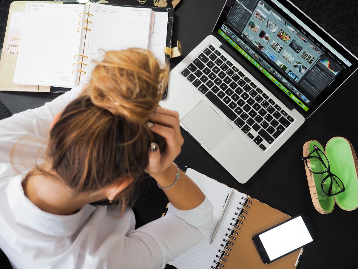 Frustrated person looking at a laptop screen